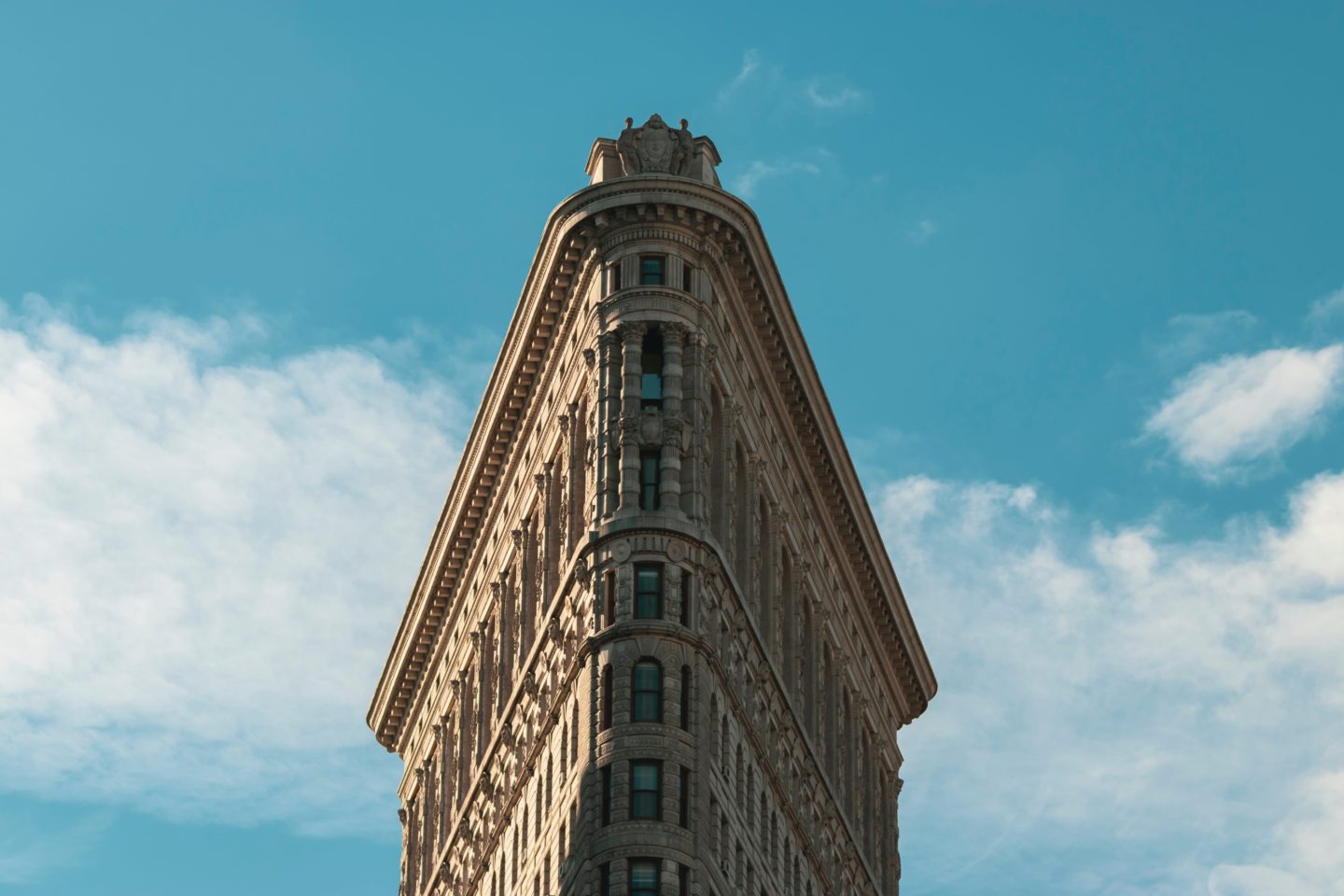 Flatiron building against a blue sky in NYC