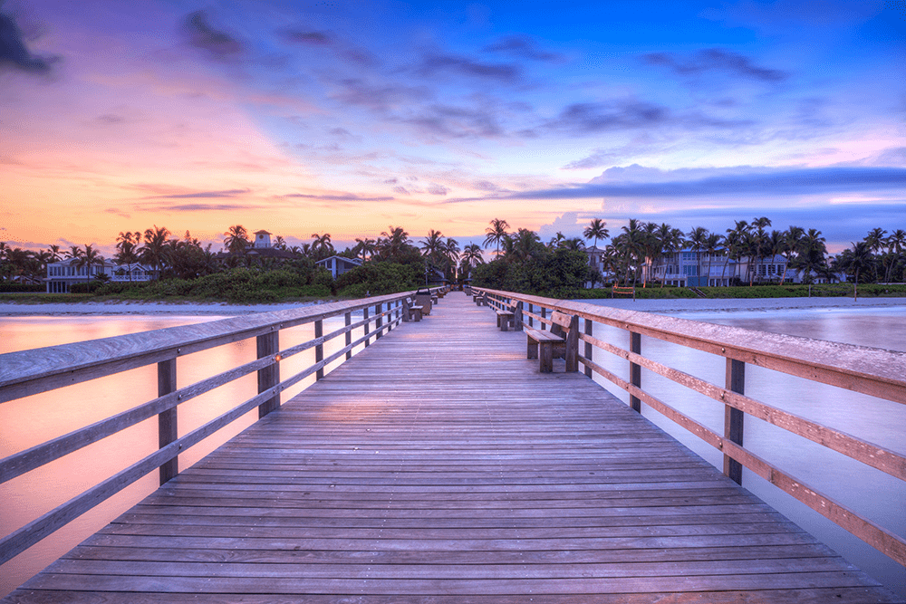 Pier in Naples, Florida near the beach at sunset