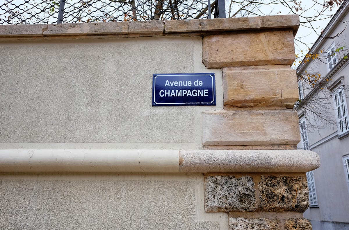 Street road sign Avenue de Champagne at a wall in Epernay, France.