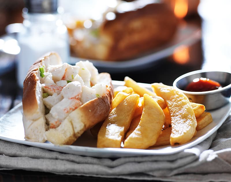 Lobster roll with fries - a popular food in Boston