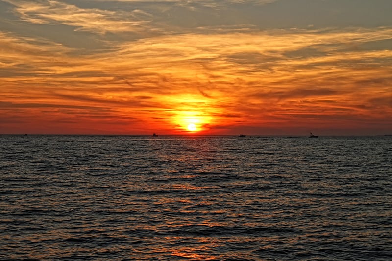 A sunset off the coast of Destin, Florida - you won't want to miss this view on a boat tour