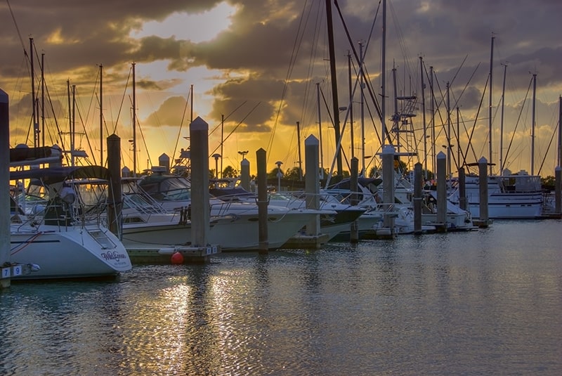 View of the Destin Harbor at sunset with several boats - you can see this view if you take a tour!