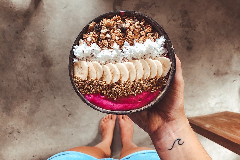 Looking down at a yummy looking acai bowl - something you might need to detox after a couple of nights out in Miami