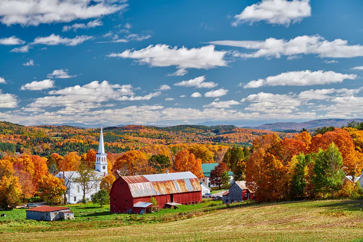 Beautiful fall landscape with lots of reds, oranges, and yellows in Vermont