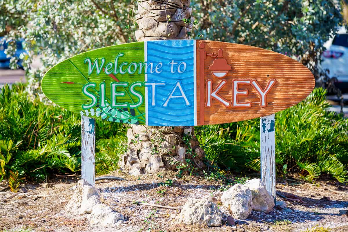 Welcome to Siesta Key sign by beach