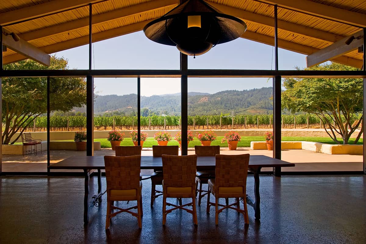 Beautiful view of the vineyards outside from an all glass room overlooking the outside views in Napa Valley