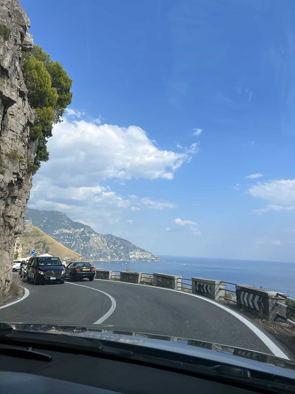 The winding drive towards Amalfi Coast - with the blue water in the background