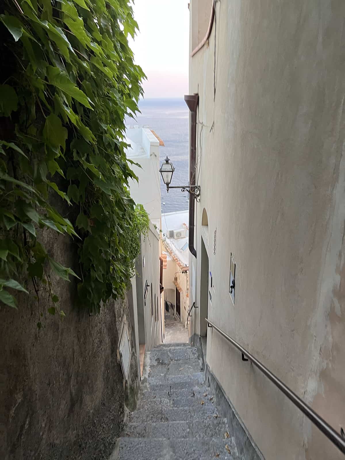 On the beautiful walk down the steps of Positano - steep but beautiful view with the water in the back