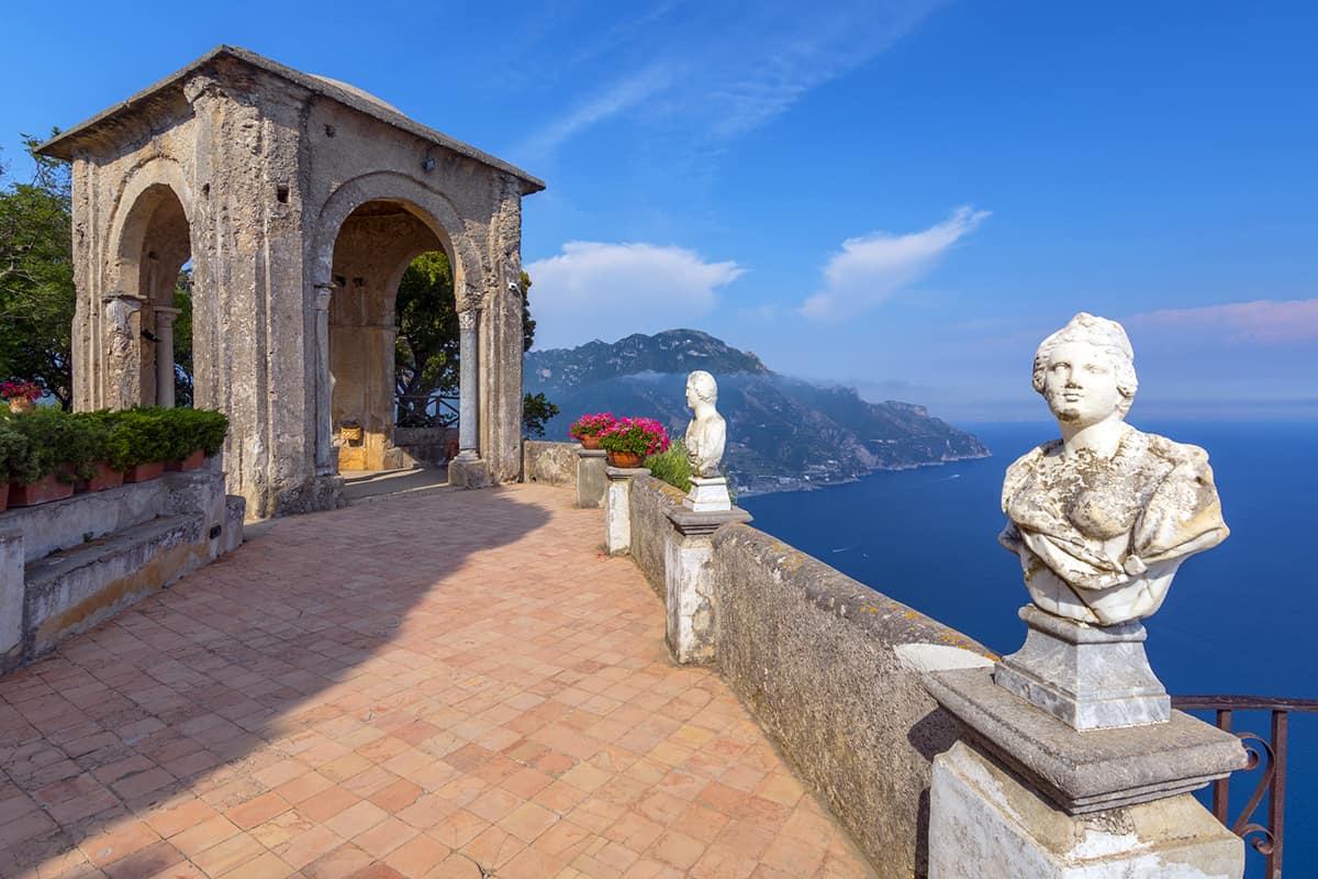 Stone statues on sunny Terrace of Infinity in Villa Cimbrone above the sea in Ravello, Amalfi Coast, Italy.