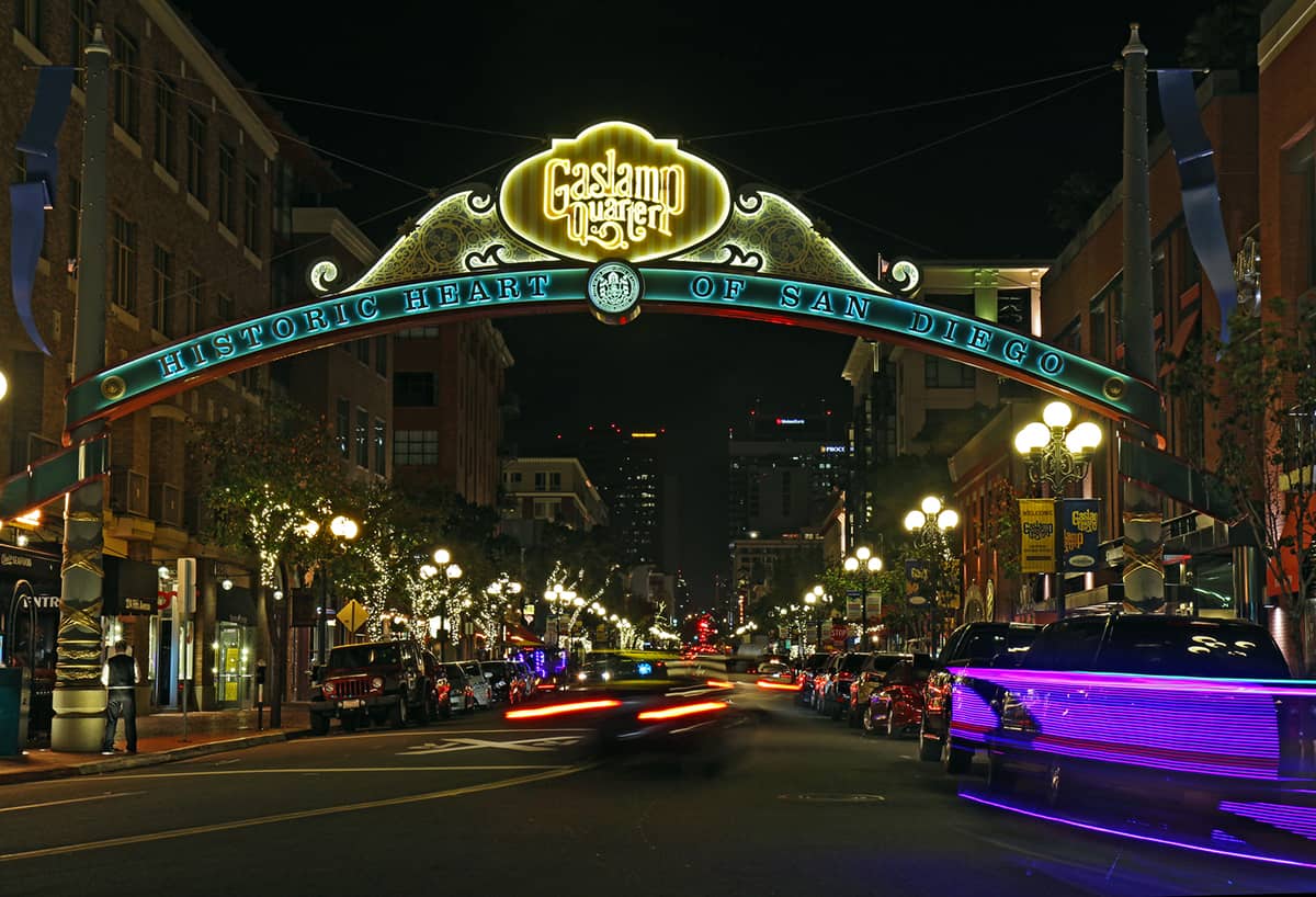 Entrance sign to the Gaslamp Quarter Historic District at night. This 16.5-block neighborhood hosts numerous festivals and is a popular tourist destination.