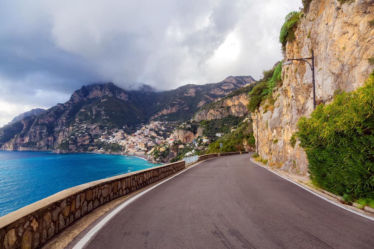Scenic Road on Rocky Cliffs and Mountain Landscape by the Tyrrhenian Sea. Amalfi Coast, Positano, Italy. Adventure Travel