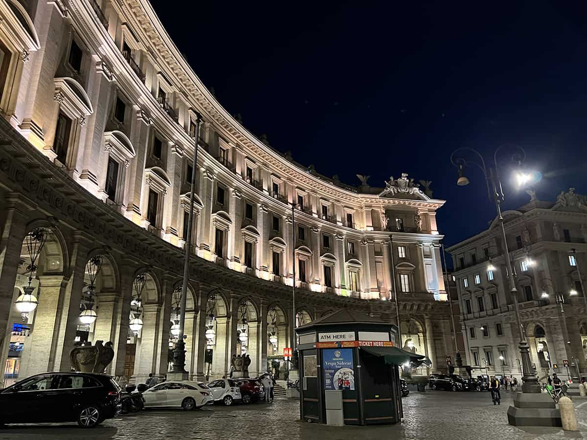 A famous hotel lit up at night in the Piazza della Repubblica at night in Rome