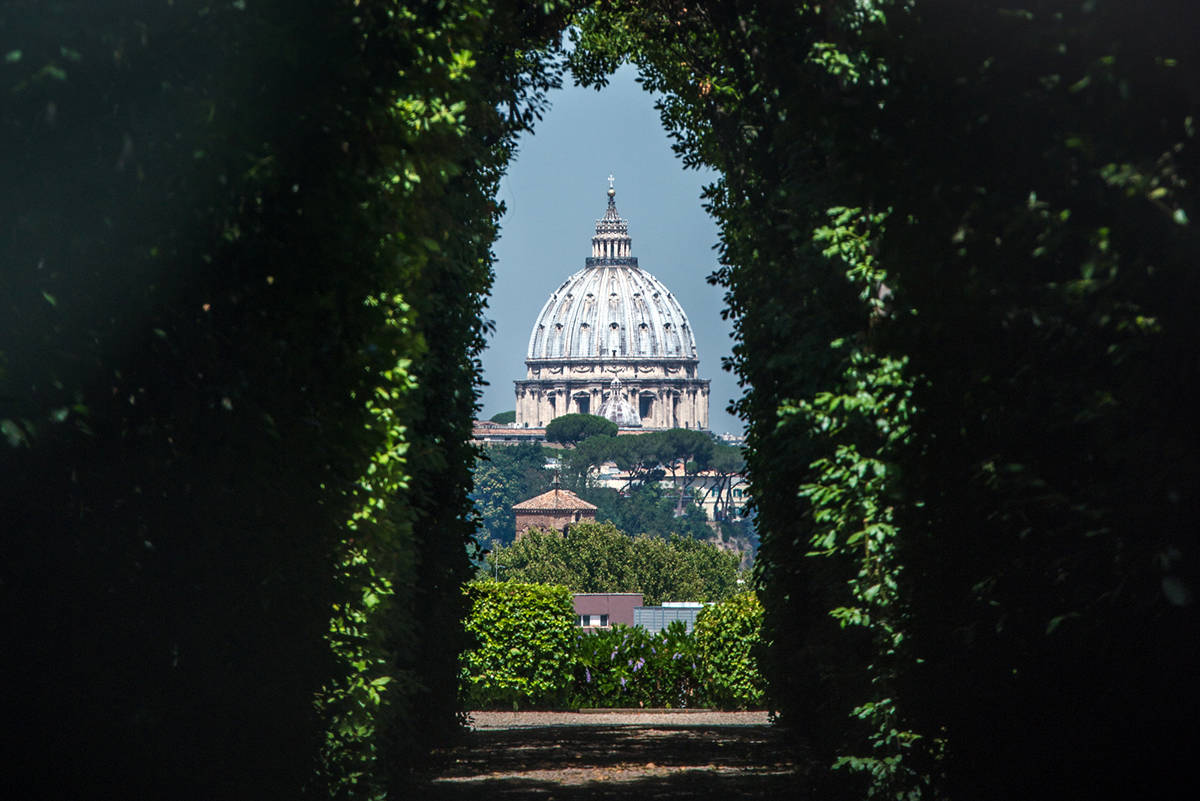 The view from peering through the Aventine Keyhole, an enchanting Roman secret that frames Saint Peter's Basilica