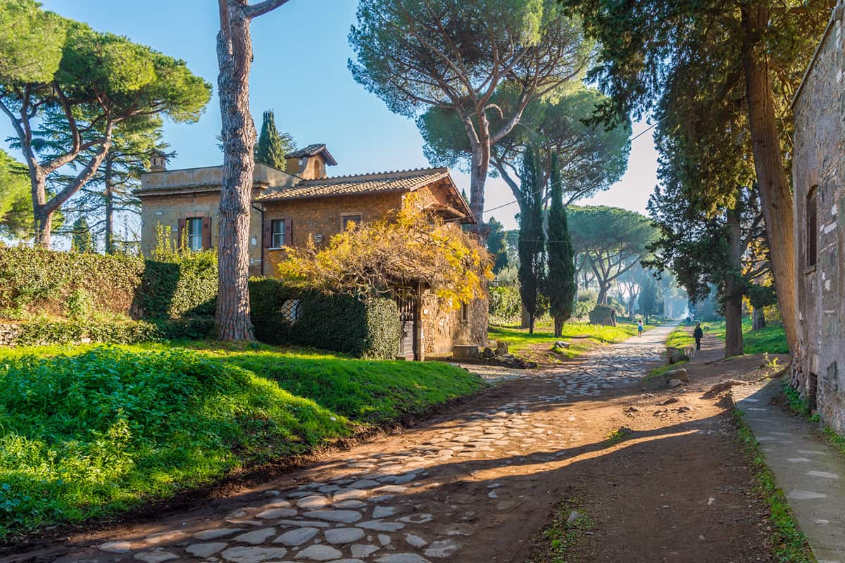 The ancient Appian Way (Appia Antica) on a sunny spring morning in Rome, Italy